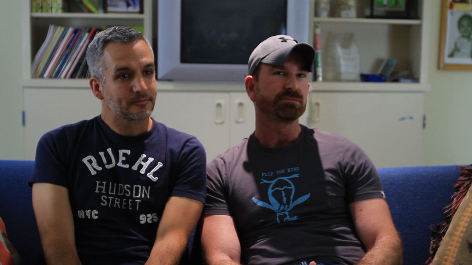 Cowboy hats & plaid shirts – two dads, one fierce love at a Pride event.